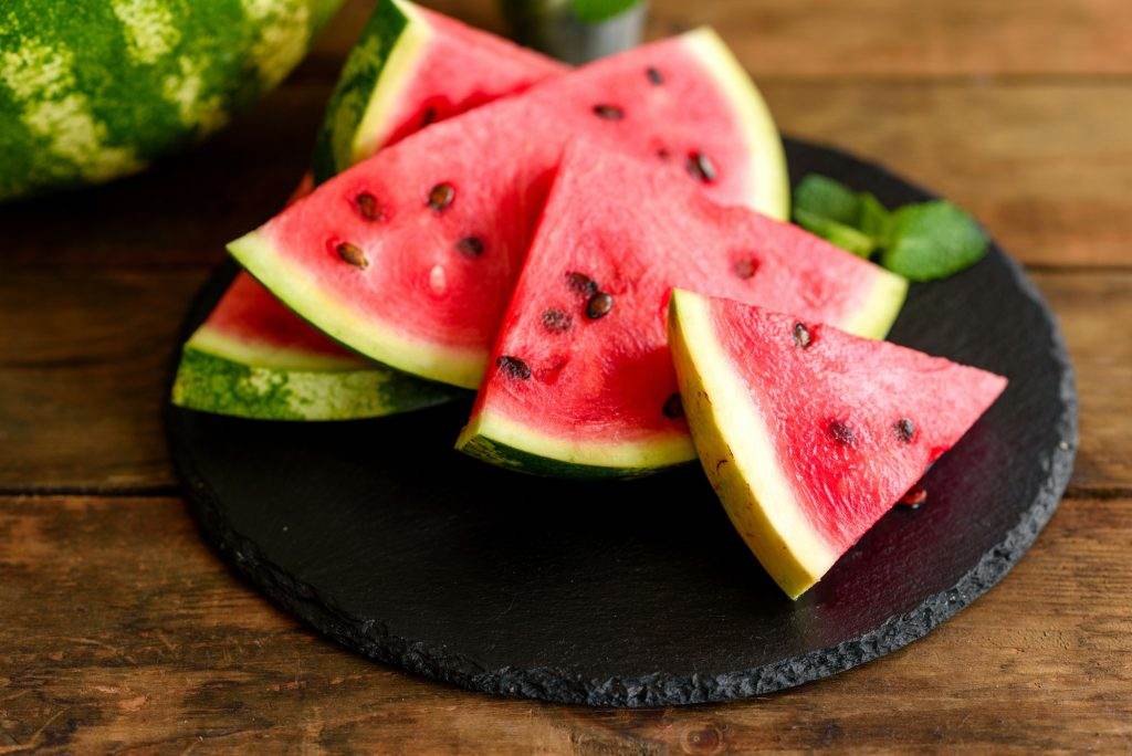 Fresh delicious watermelon sliced with mint and watermelon juice
