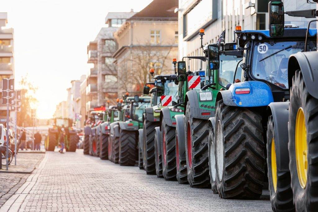 Farmers union protest strike against government Policy in Germany Europe. Tractors vehicles blocks