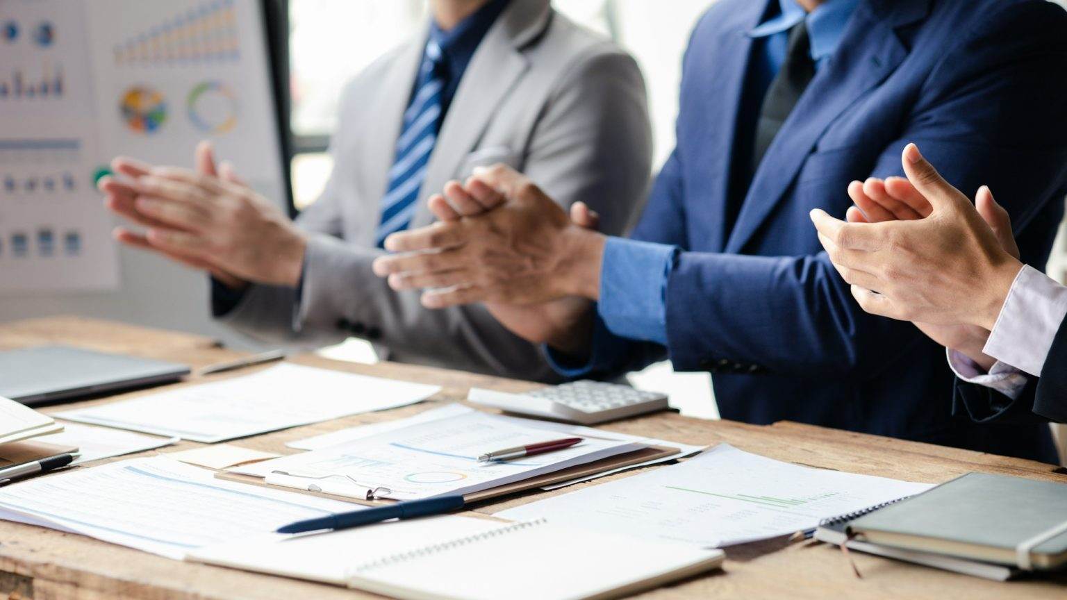 Group business people applauding at startup company meeting, business meetings, startup company sale