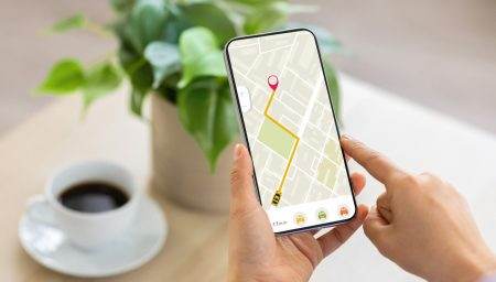 Cropped of woman using navigation mobile app on smartphone