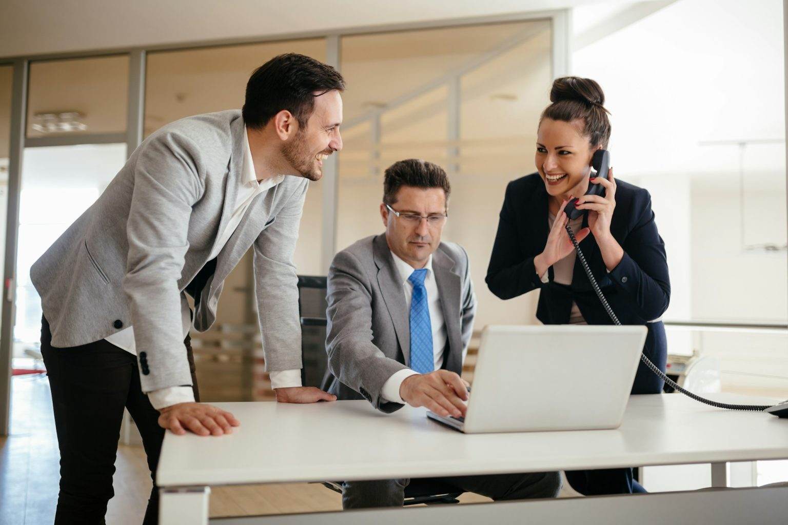 Busy business people helping boss