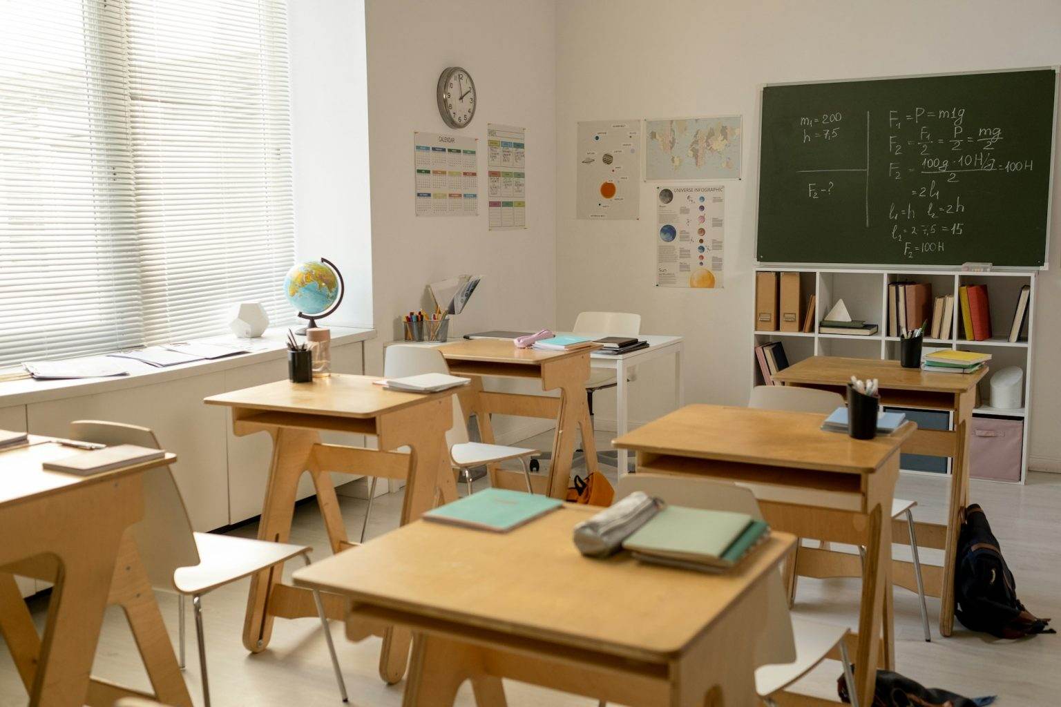 Large classroom in contemporary school with rows of desks