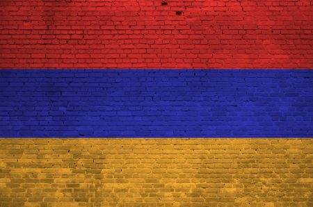Armenia flag depicted in paint colors on old brick wall close up