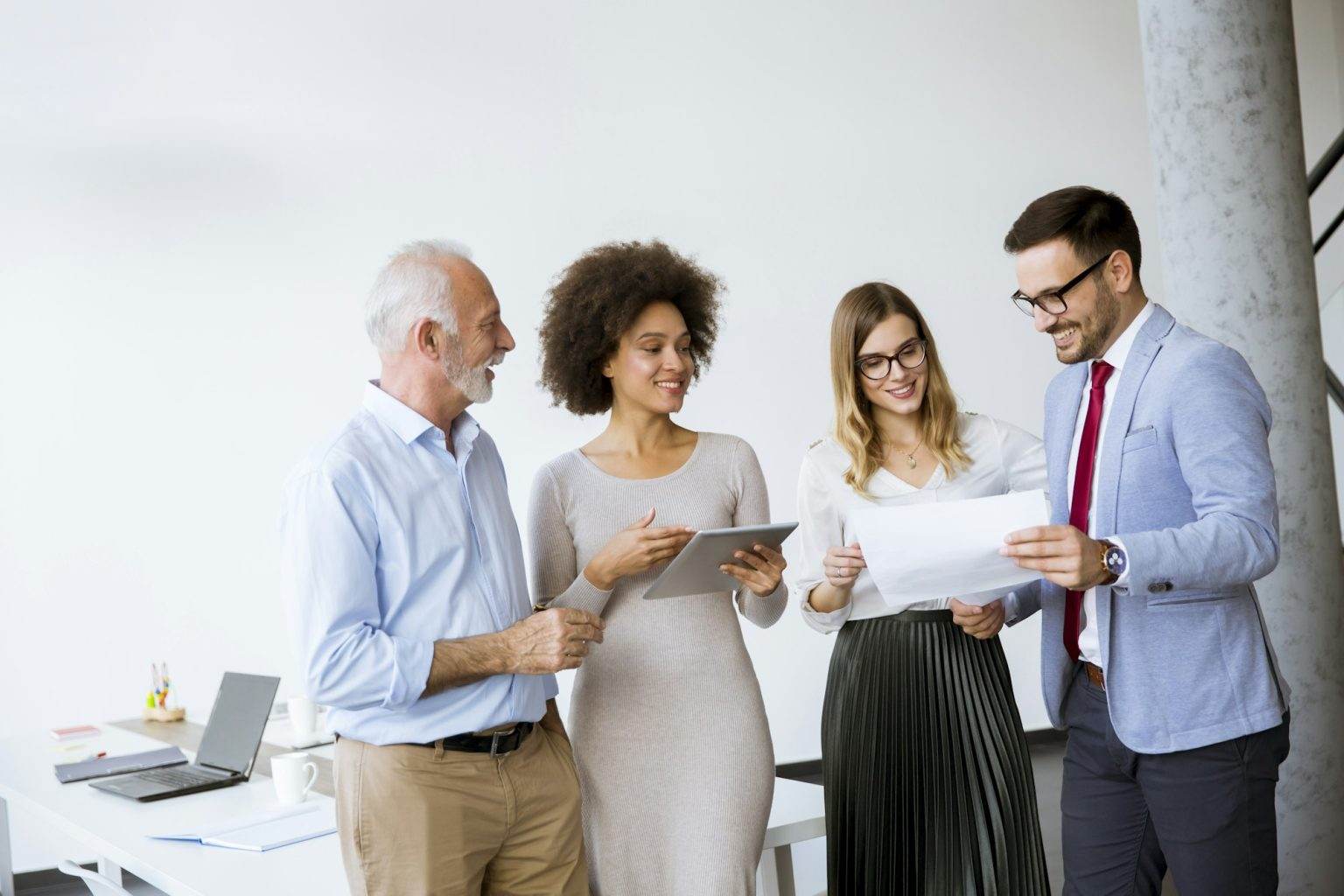 Image of business partners discussing documents and ideas