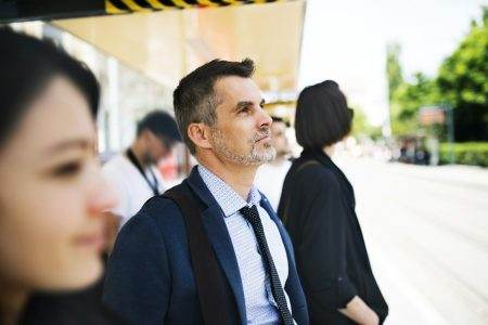 Businessman waiting at the bus stop