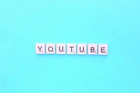 YouTube scrabble letters word on a light blue background