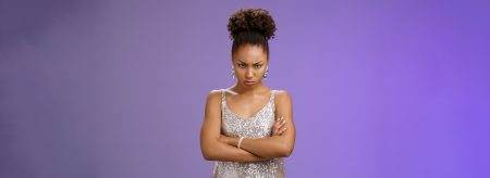 Sulking immature african-american woman sulking offended look from under forehead pouting cross