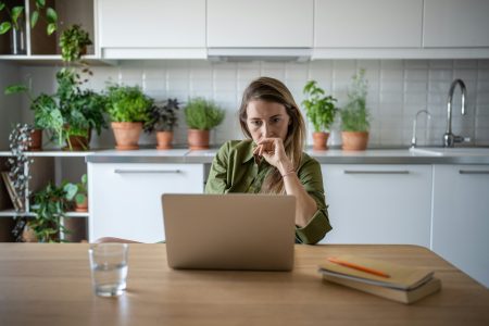 Busy accountant freelance woman working at home feeling upset with results of financial statement