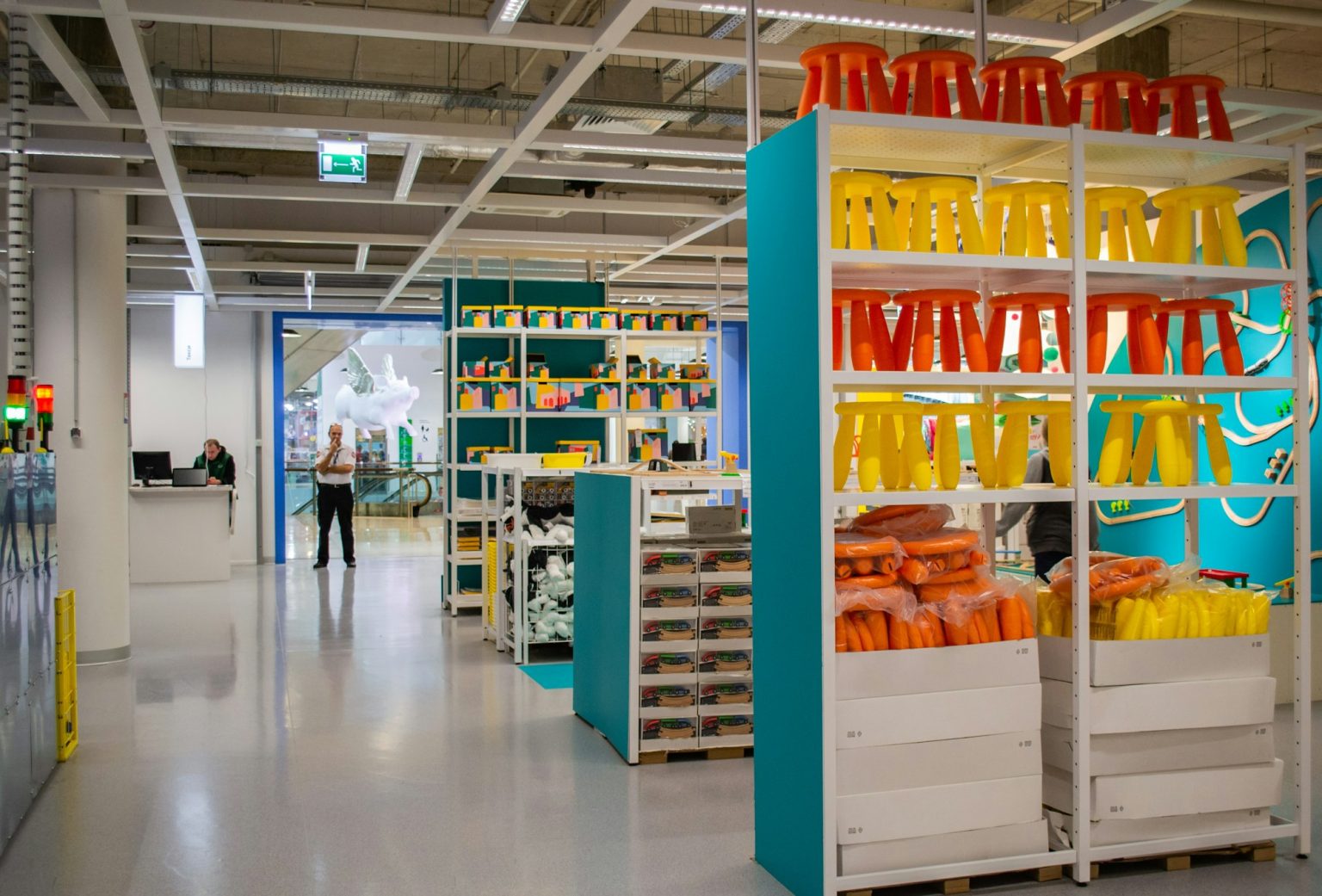 Entrance to IKEA from inside the store. Shelves with bright goods for children