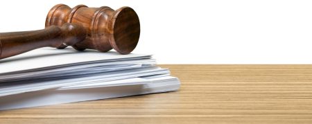 judge hammer on white paper and table