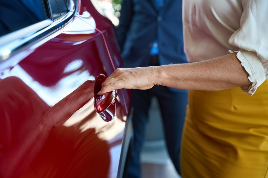 Wife and husband choosing auto in salon