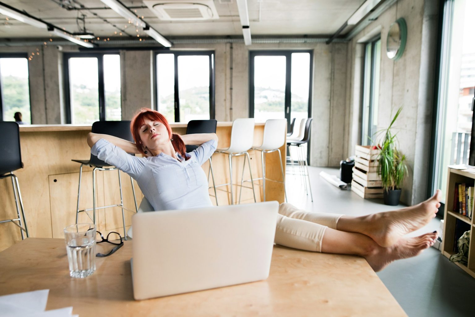 Businesswoman with laptop in her office.