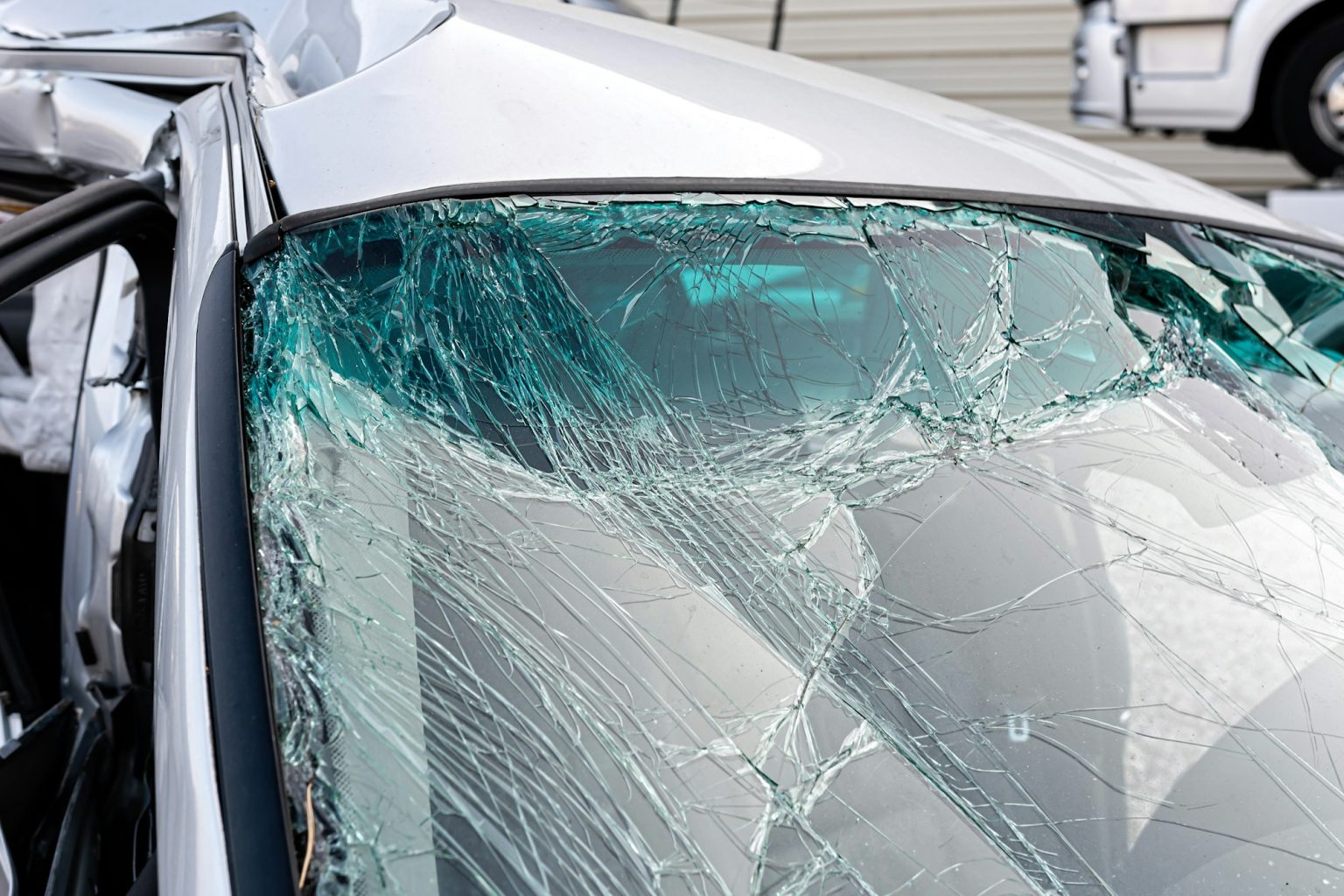 damaged vehicle closeup after a heavy crash, traffic accident, insurance concept
