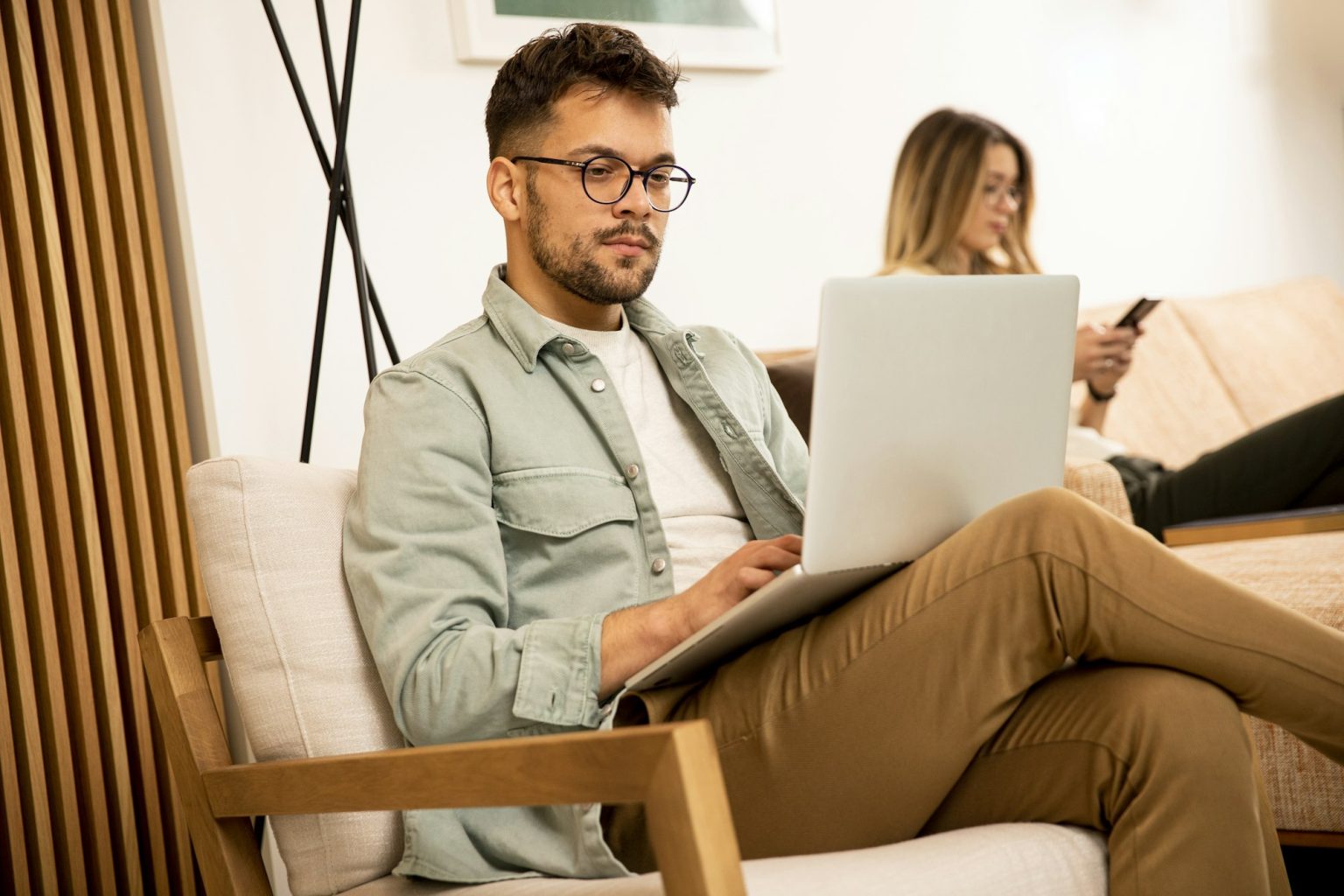 Young man using laptop at home