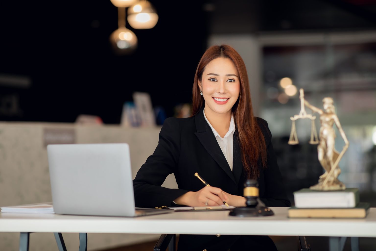 Attractive young lawyer in office Business woman and lawyers discussing contract papers with brass s