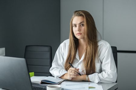 Cash reward. Woman businesswoman works in the office.