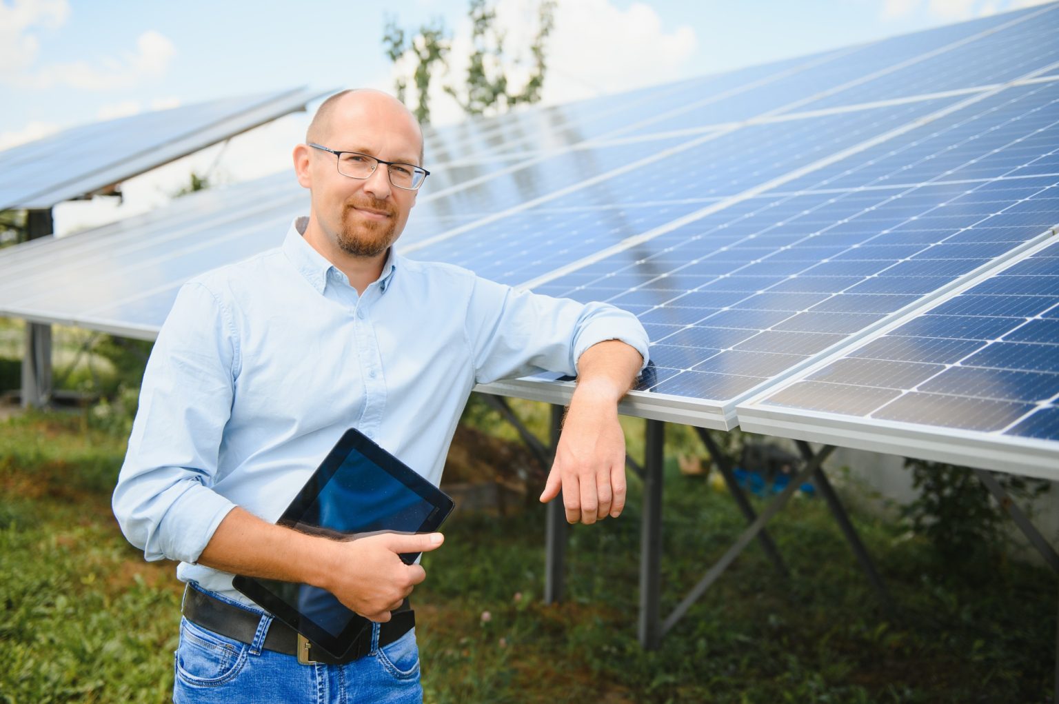 Engineer at solar power station with solar panel