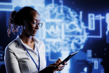 IT admin writes AI code on laptop