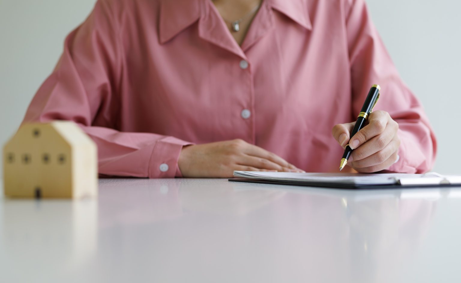 Signing of a real estate contract. Home Insurance and Real Estate