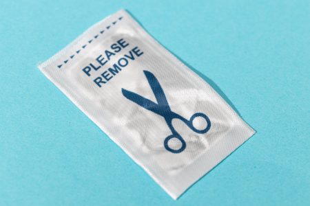 Retail security soft tag anti theft RFID isolated on blue background