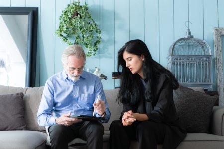 Senior executives and insurance agents providing detailed information about the insurance policy