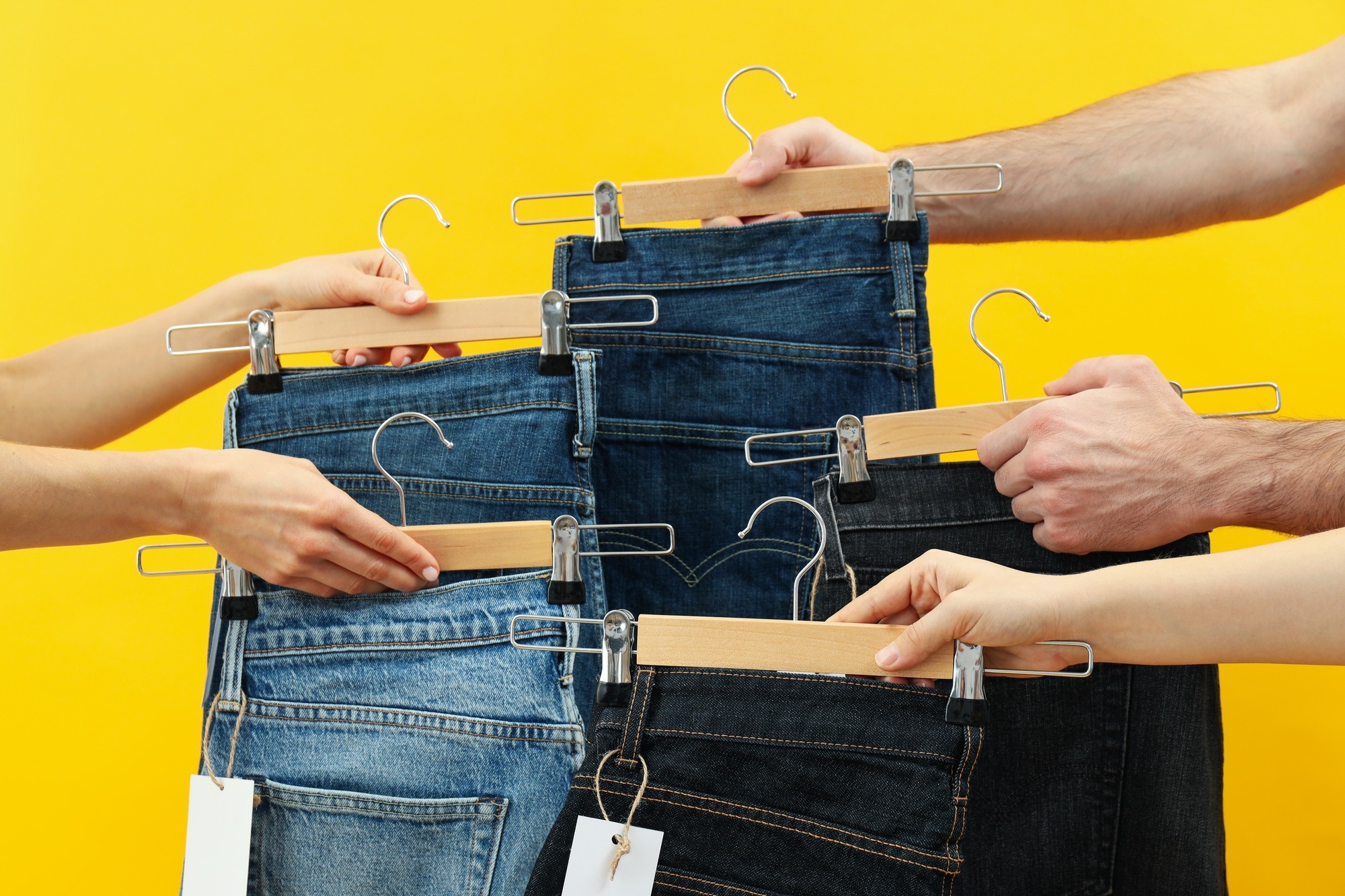 Ukraine, Kyiv, 08.10.2023 Jeans with tags on hangers