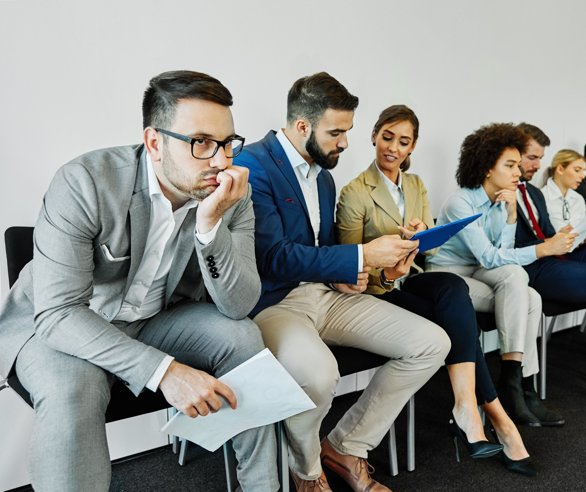 man business chair sitting waiting businessman candidate recruitment office businesswoman woman