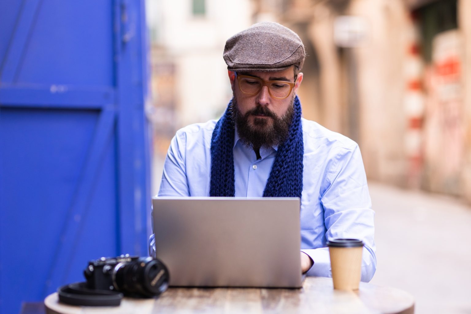 Photojournalist transferring his photos to his laptop
