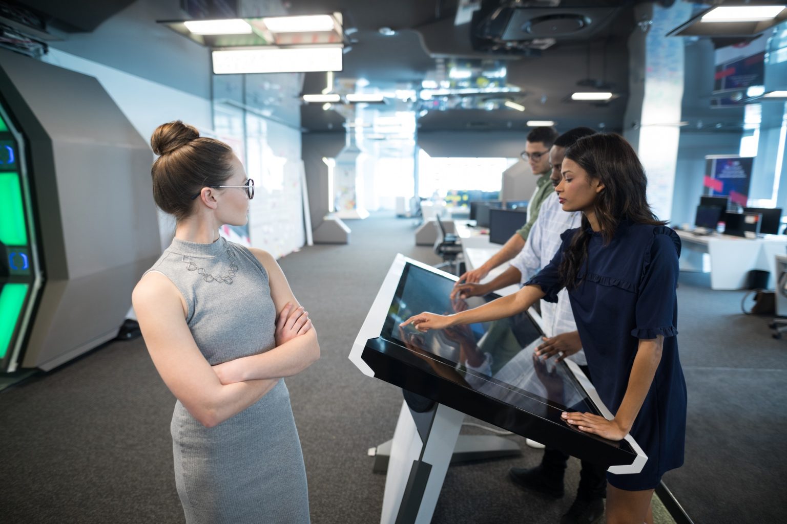 Business executives touching digital screen