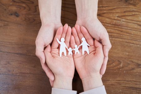 Asian men and women thinking about their families