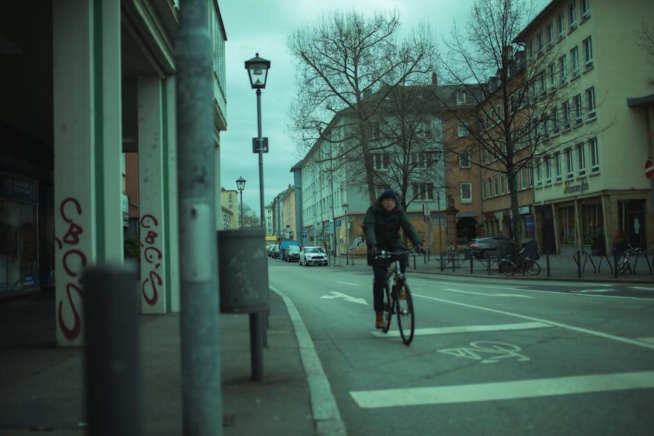 Cyclist riding in an urban street with a modern bicycle
