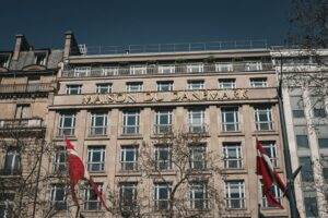 Elegant 19th-century Danish building 'Maison du Danemark' in Paris with flags