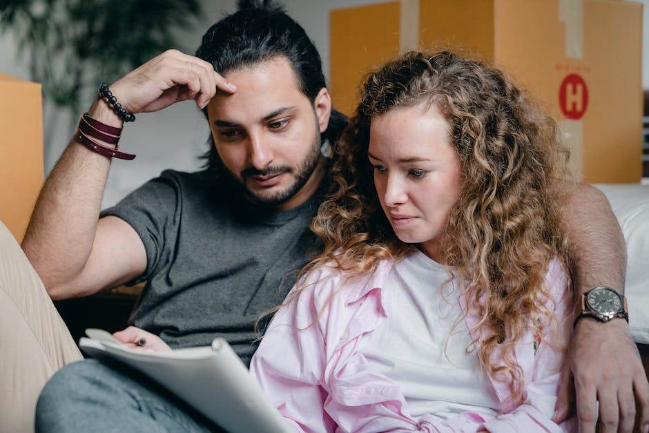 Family planning a move with boxes and paperwork