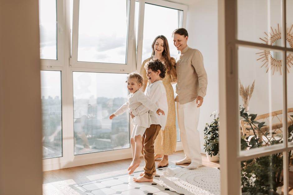 Family opening windows to ventilate a home in winter