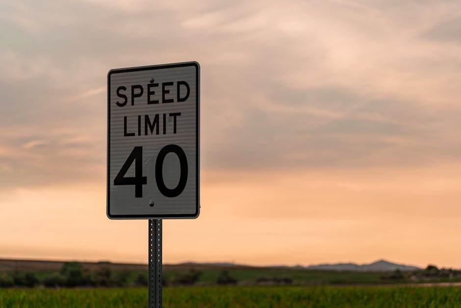 Car driving on a highway with speed limit sign