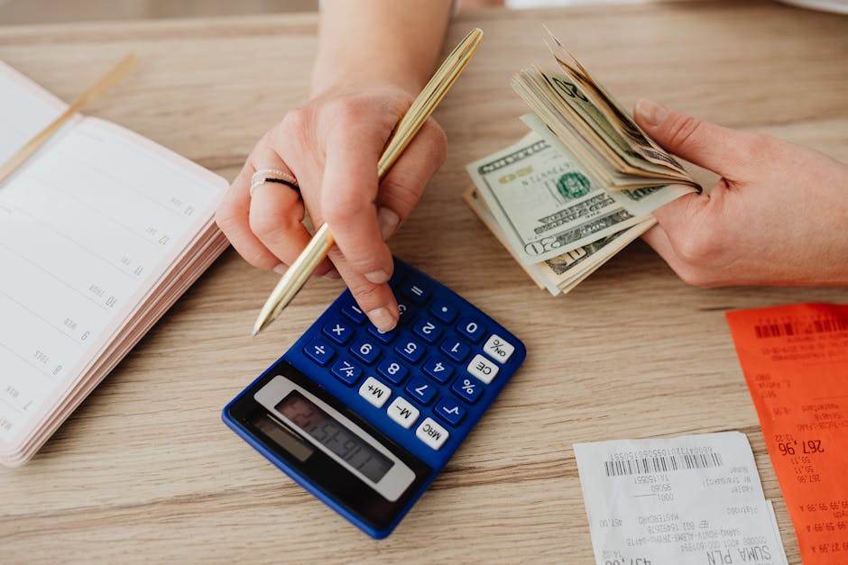 Home buyer reviewing mortgage documents and monthly budget