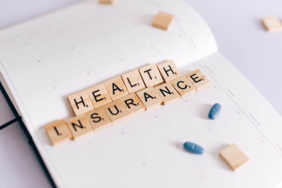 Quelle assurance choisir pour un déménagement sans surprise en 2026 Close-up of health insurance spelled out with Scrabble tiles on a planner, alongside medication pills.