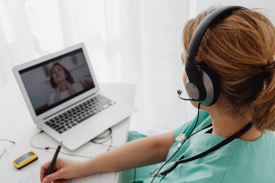 Person using a laptop to manage healthcare or administrative tasks online