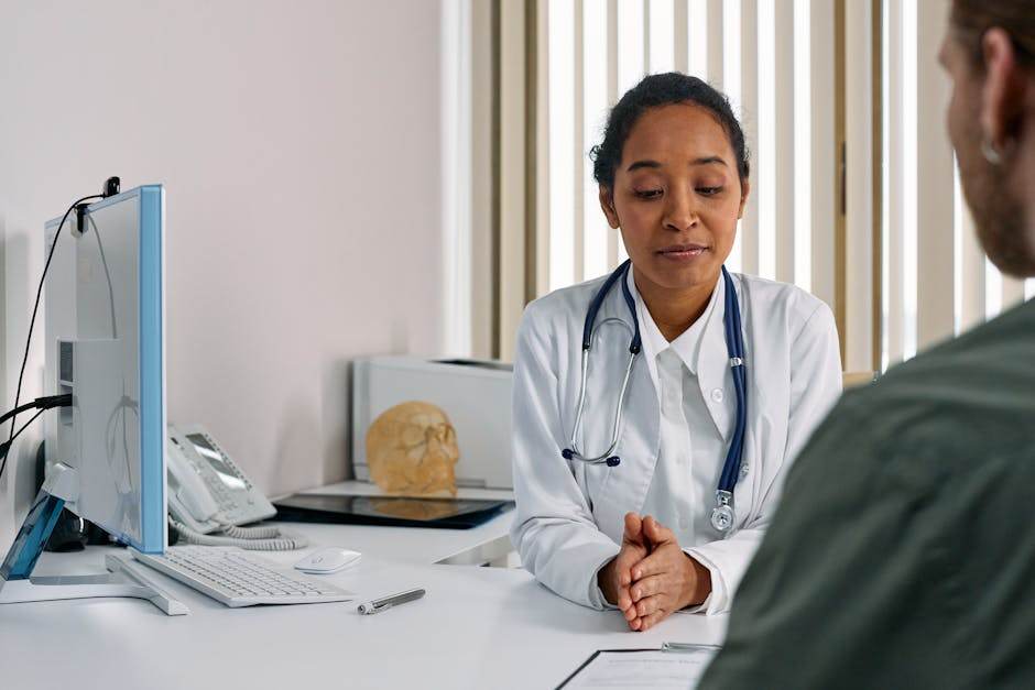 Doctor and patient discussing health insurance or medical history