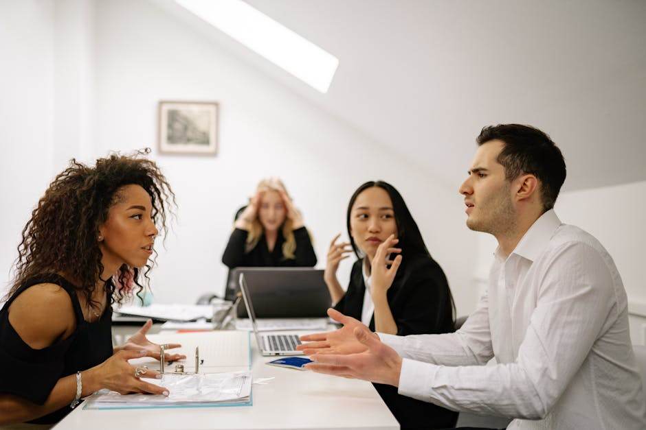 French office workers discussing a corporate restructuring plan