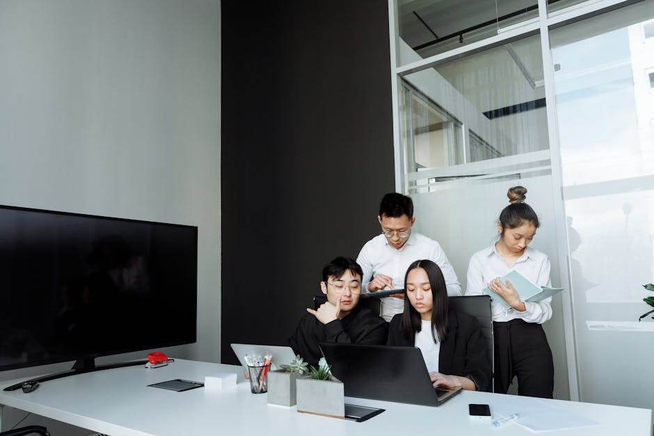 Assurtech startup team working on digital insurance platform