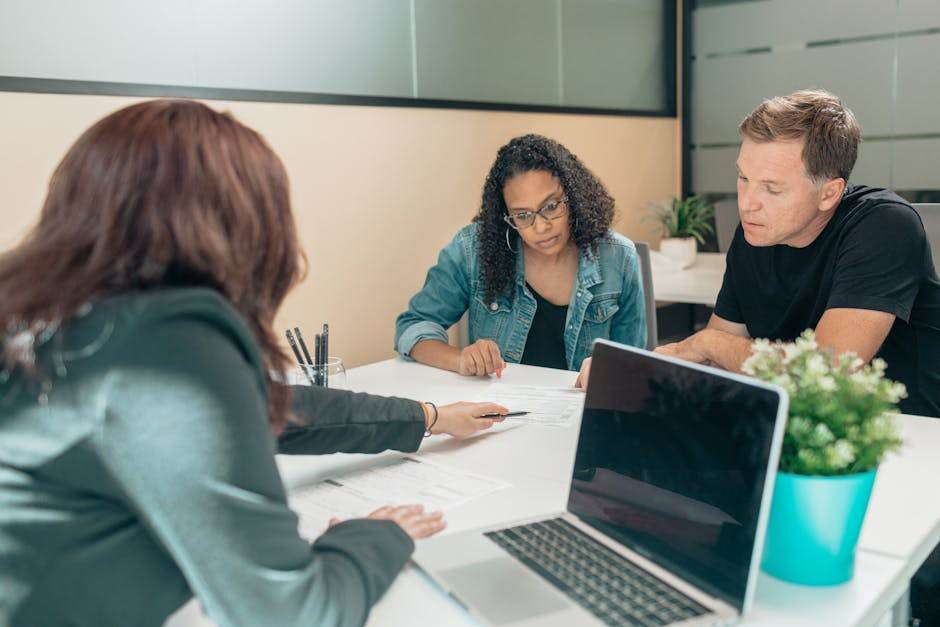Couple discussing mortgage application with a bank advisor