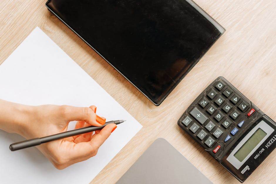 Bicycle insurance paperwork with calculator and pen