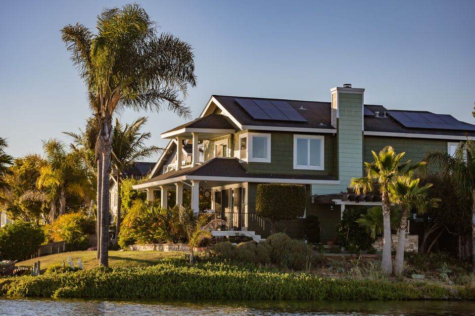 Person using home appliances while solar energy is produced