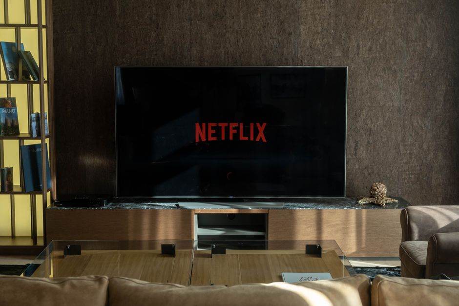 Home electronics setup with TV, console and router in a living room