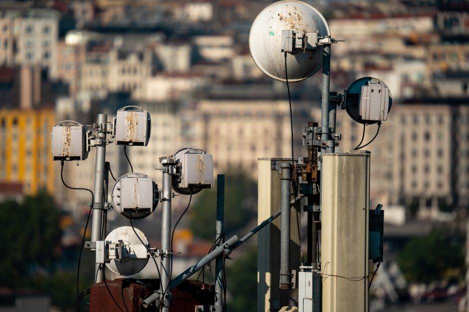 Paris rooftop with 5G antennas and city skyline