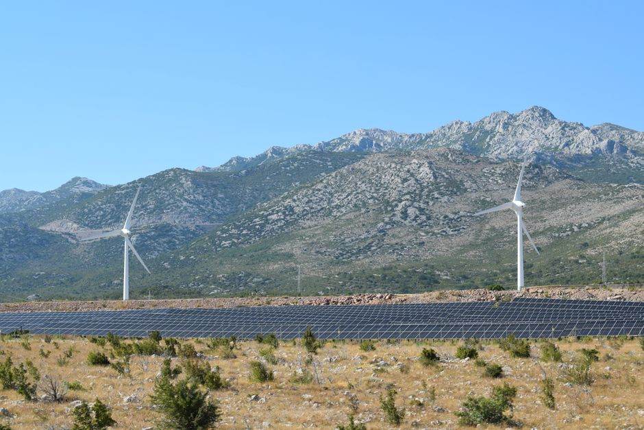 Wind turbines and solar panels in a renewable energy landscape