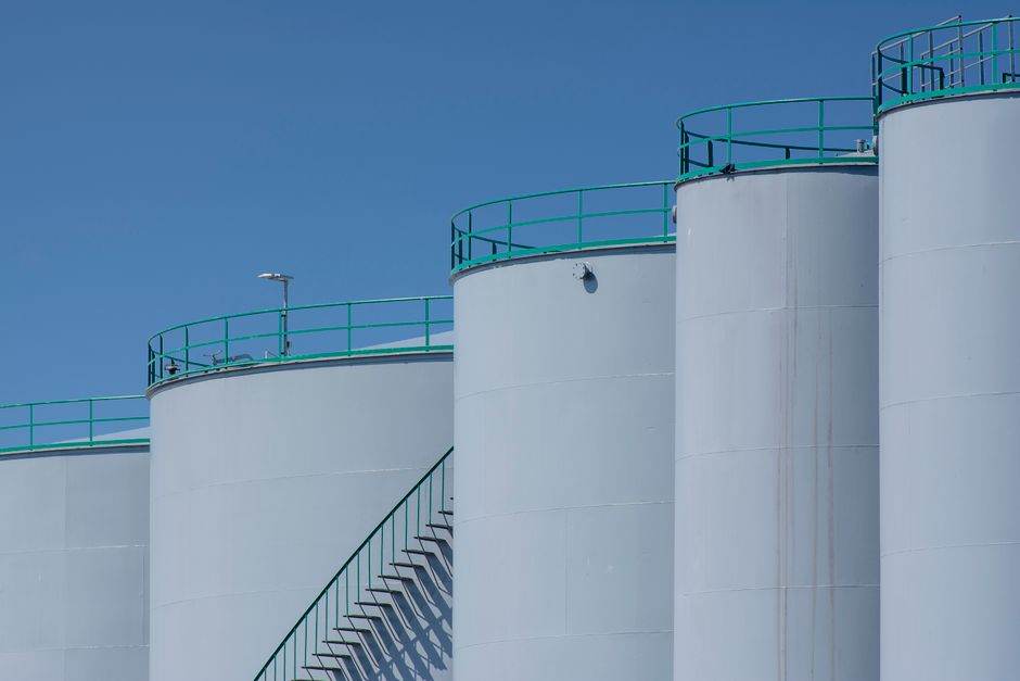 Liquefied natural gas terminal with storage tanks and industrial pipes