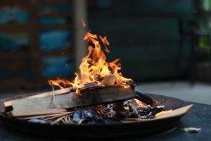 A vibrant flame in an indoor fire pit, perfect for warmth and ambiance.