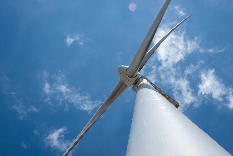 Close-up of wind turbines turning in strong wind